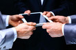 © PhotoStar - Businessmen working on a digital tablet