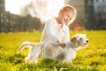 Little girl with her puppy dog