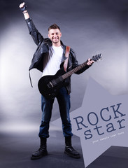 Poster - Young musician playing  guitar on gray background