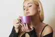 © eugenepartyzan - Beautiful blond woman drinking Coffee. Cup of tea.Delicious