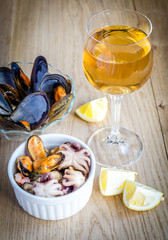 Sticker - Mussels with a glass of white wine on the wooden table