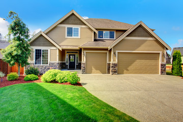 Siding house with stone trim and tile roof