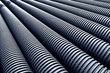 Close up of black plastic pipes with diminishing perspective