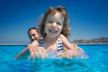 Wall Mural - Family in swimming pool