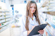 © aboutmomentsimages - portrait of blonde pharmacist or health care worker
