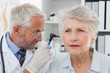 © WavebreakMediaMicro - Doctor examining senior patient's ear