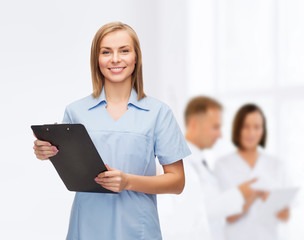 Sticker - smiling female doctor or nurse with clipboard