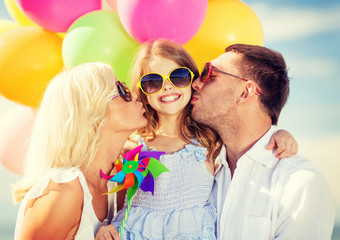 family with colorful balloons