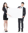 © ChenPG - Business man and woman holding blank white board