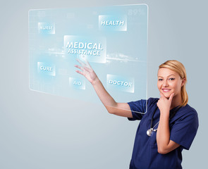 Young nurse pressing modern medical type of buttons