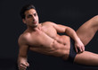 © starsstudio - Handsome latin young man naked on floor
