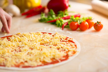 Italian Pizza Preparation. Cheese Covering.