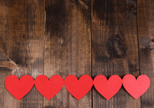Paper Hearts On Wooden Background