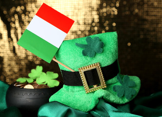 Saint Patrick day hat, pot of gold coins and Irish flag