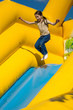 © 31etc - Young girl jumping on attractions