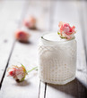 Rose flavor Greek yogurt in a glass jarwith lace