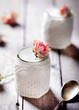 Rose flavor Greek yogurt in a glass jarwith lace