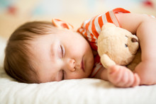 Infant Baby Sleeping With Plush Toy