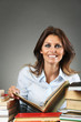 © captblack76 - Smiling woman among books