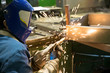 © Fotolia RAW - Industrial Welder during Welding  Works at Factory Workshop