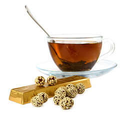 Wall Mural - isolated image of a cup of tea and candy on a white background