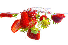 Fresh Strawberry Dropped Into Water With Splash On White Backgrounds