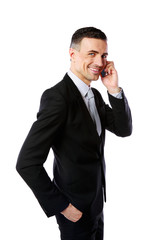 Wall Mural - Portrait of a happy businessman with phone