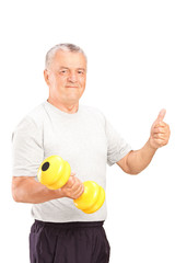 Poster - Mature man lifting a dumbbell and giving thumb up