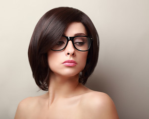 Beautiful woman in glasses. Short black hair style