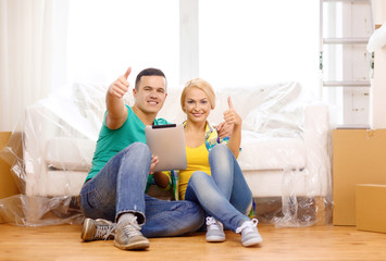 Sticker - smiling couple with tablet pc in new home