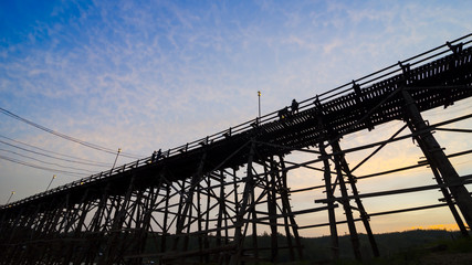 Wall Mural - The old wooden bridge Bridge collapse Bridge across the river and Wood bridge (Mon bridge )at sangklaburi, kanchanaburi, Province Asia thailand