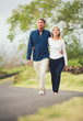 © EpicStockMedia - Happy loving middle aged couple walking