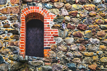 Steel door in stone wall