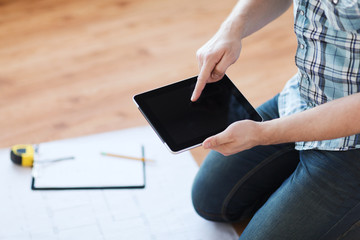 Poster - male with tablet pc, blueprint and measuring tape