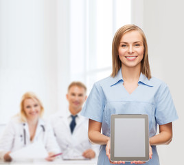 Poster - smiling female doctor or nurse with tablet pc