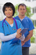 © mihalec - portrait of a medical team on a background of blurred hospital