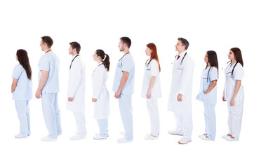 large group of medical staff standing in a queue