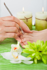 Wall Mural - Beautician Giving Pedicure Treatment