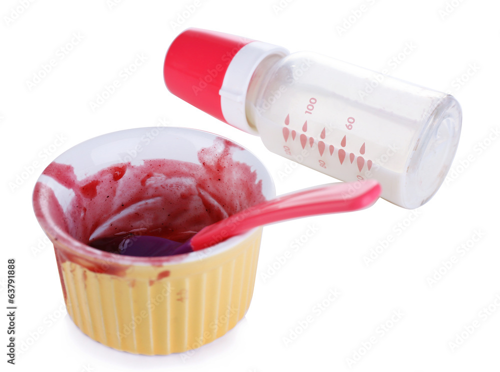 Baby bottle with milk and dirty bowl isolated on white