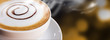 Coffee cup and saucer on bokeh background