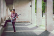 © tinx - Man in short sleeve shirt playing electric guitar
