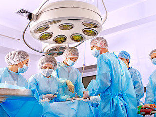 Surgeon at work in operating room.