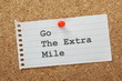 Go The Extra Mile reminder on a cork notice board