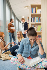 Sticker - Girl reading book in college library