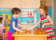 © spass - Two little girls playing in checkers at kindergarten