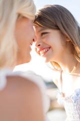 Wall Mural - happy mother and child girl outdoors