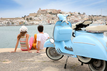 Tourists Looking At The Town Of Ibiza, Moto In Foreground