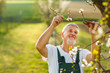 © lightpoet - Portrait of a handsome senior man gardening in his garden