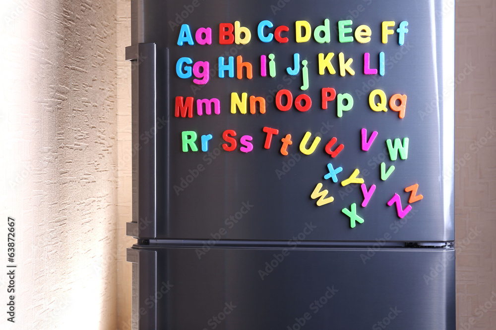 Colorful magnetic letters on  refrigerator