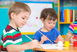 © spass - Cute children drawing with colorful paints at kindergarten